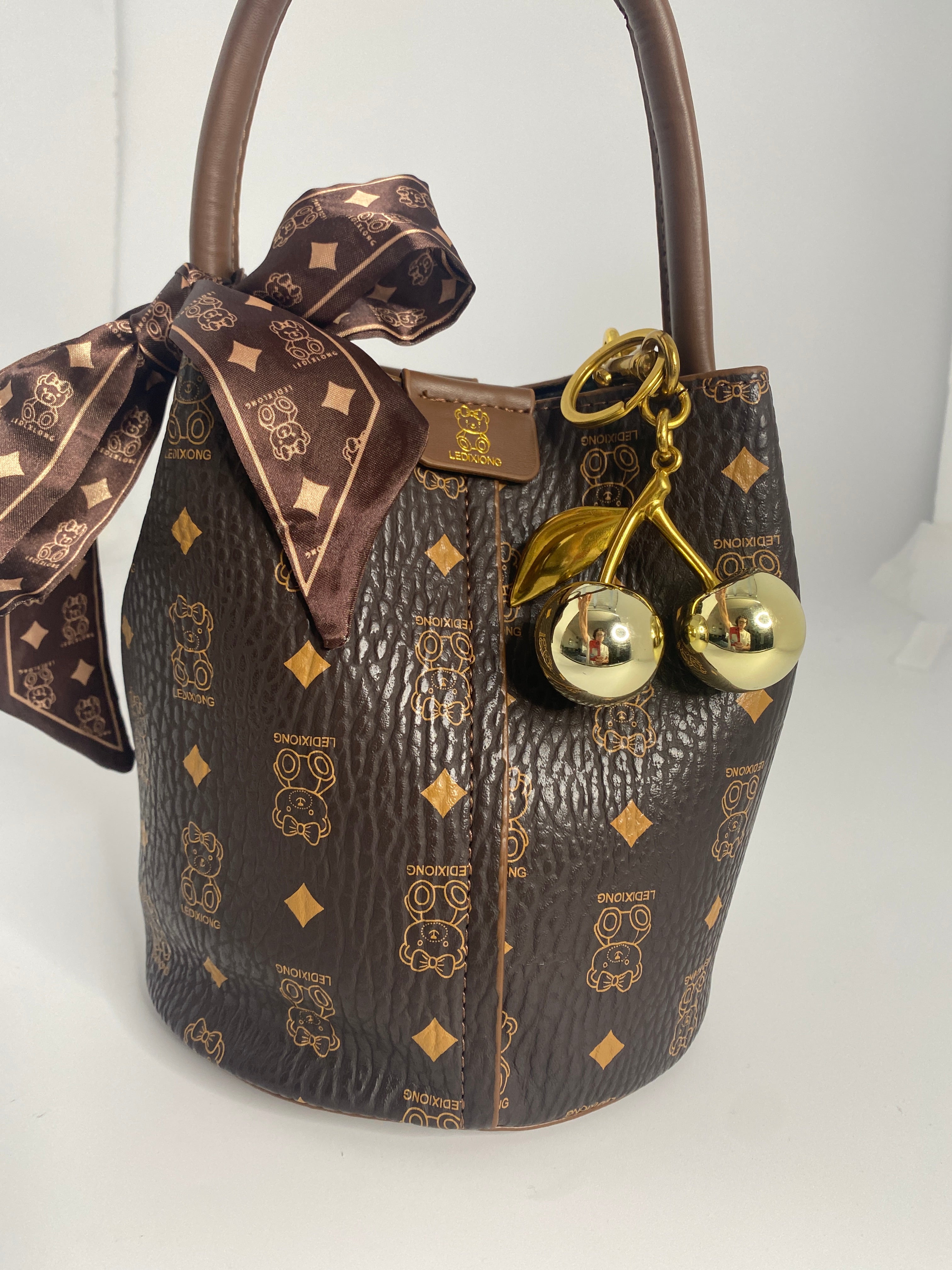 BABY BEAR MONOGRAMMED LEATHER BUCKET BAG